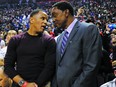 Former Raptor Damon Stoudamire speaks with Isiah Thomas during the first half of last night's Game 1 in Toronto, Ont. on Thursday May 30, 2019. Jack Boland/Toronto Sun/Postmedia Network