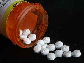 This Aug. 29, 2018, file photo shows an arrangement of prescription oxycodone pills in New York.