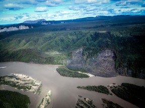 In this undated photo, abrupt permafrost melting has caused a large landslide into a side channel of the Mackenzie River in the Northwest Territories. Permafrost in some areas of the Canadian Arctic is melting so fast that it's gulping up the equipment left there to study it.
