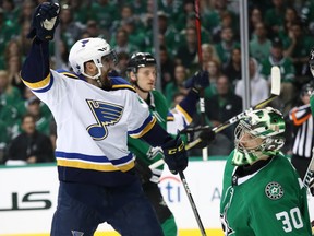 St. Louis' David Perron celebrates a goal in front of Stars goalies Ben Bishop during Game Six of their series Sunday. (Getty)