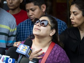 Surrounded by family members and supporters, Marlen Ochoa-Lopez's mother, Raquel Uriostegui, talks to reporters outside the Cook County medical examiner's office after identifying her daughter's body, Thursday, May 16, 2019 in Chicago.
