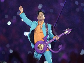 In this Feb. 4, 2007, file photo, Prince performs during the halftime show at Super Bowl XLI at Dolphin Stadium in Miami.