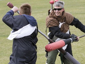 Darrin Chaika (right) and Michael Del Pero, 14, do battle as members of the Amtgard medieval fantasy live action role playing group meet in Jackie Parker Park, 4540 - 50 St., in Edmonton, Alta. on Saturday May 16, 2015.