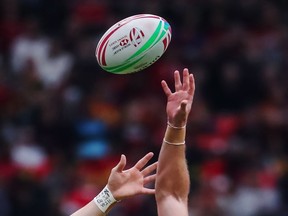 Canada's Jake Thiel (left) jumps for the ball against Australia's Nick Malouf during the Challenge Trophy final at the World Rugby Sevens Series action in Vancouver, on March 10, 2019.