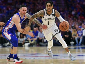 D'Angelo Russell of the Brooklyn Nets drives around JJ Redick of the Philadelphia 76ers at Wells Fargo Center on April 13, 2019 in Philadelphia.  (Drew Hallowell/Getty Images)
