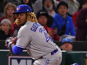 Vladimir Guerrero Jr. of the Toronto Blue Jays throws out Tommy La Stella of the Los Angeles Angels at first base in the seventh inning of the game at Angel Stadium of Anaheim on May 1, 2019 in Anaheim, Calif. (JAYNE KAMIN-ONCEA/Getty Images)