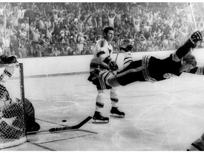 In this May 10, 1970, file photo, Boston Bruins' Bobby Orr goes into the air after scoring a goal against the St. Louis Blues that won the Stanley Cup for the Bruins, in Boston.