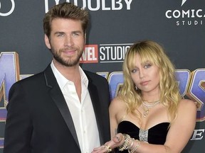 Liam Hemsworth and Miley Cyrus attend the World Premiere of Marvel Studios' 'Avengers: Endgame' held at the Los Angeles Convention Center in Los Angeles, California on April 2, 2019.