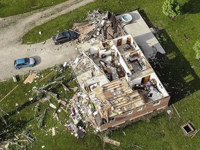 Storm damaged homes remain after a tornado passed through the area the previous evening, Tuesday, May 28, 2019, in Brookville, Ohio. (AP Photo/John Minchillo)