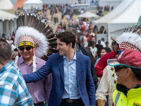 Prime Minister Justin Trudeau shakes hands following the exoneration for Chief Poundmaker event at a community ceremony at the Chief Poundmaker Historical Centre on the Poundmaker First Nation, Thursday, May 23, 2019.