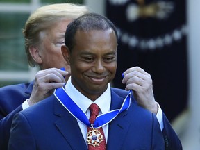 President Donald Trump awards the Presidential Medal of Freedom to Tiger Woods during a ceremony in the Rose Garden of the White House in Washington, Monday, May 6, 2019.