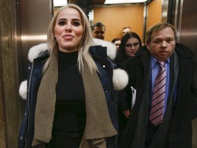 Marcella Zoia, 19, better known now as "Chair Girl" was all smiles as she exited the College Park courthouse with her lawyer Greg Leslie (right).