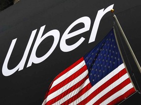 In this May 10, 2019, file photo a banner for Uber is draped on the front of the New York Stock Exchange. (AP Photo/Mark Lennihan, File)