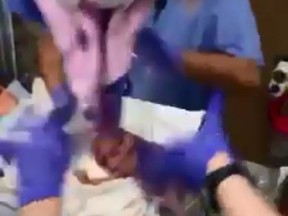 A video shot by parents Monique and Derrick Rodgers reportedly shows their newborn daughter being dropped on her head by hospital staff. (Facebook)