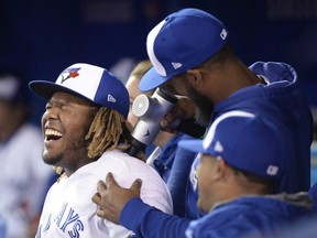 Jays third baseman Vladimir Guerrero Jr. clowns around with teammates during Wednesdays game versus Minnesota.