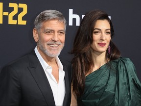 George Clooney and wife Amal attend the premiere of Hulu's "Catch-22" at  the TCL Chinese Theatre in Hollywood, Calif., May 7, 2019. (Sheri Determan/WENN.com)