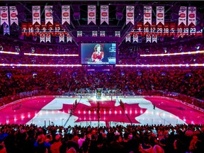 The Canadian flag is projected onto the ice at the Bell Centre during the singing of the national anthem before NHL game between the Canadiens and Florida Panthers at the Bell Centre in Montreal on Jan. 15, 2019.