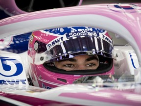 Racing Point driver Lance Stroll watches the monitor as he waits to head out on the track during practice rounds at Circuit Gilles-Villeneuve in Montreal on Friday, June 7, 2019.