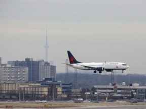 An Air Canada Boeing 737 MAX 8 jet approaches Toronto Pearson International Airport for landing on March 13, 2019 in Toronto, Canada.