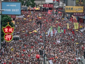 Protesters march on a street during a rally against a controversial extradition law proposal on June 9, 2019 in Hong Kong. (Anthony Kwan/Getty Images)