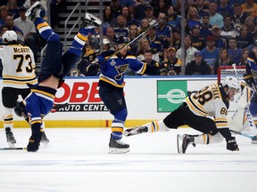 Brayden Schenn of the St. Louis Blues gets tripped up against the Boston Bruins during the first period in Game Three of the Stanley Cup Final at Enterprise Center in St Louis on Saturday night. (Photo by Bruce Bennett/Getty Images)