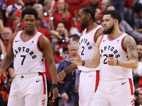 Kyle Lowry and Fred VanVleet of the Toronto Raptors react against the Golden State Warriors in the first half during Game 2 of the 2019 NBA Finals at Scotiabank Arena on June 2, 2019 in Toronto.