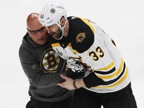 Zdeno Chara #33 of the Boston Bruins is attended to after being injured during the game against the St. Louis Blues in Game Four of the 2019 NHL Stanley Cup Final at Enterprise Center on June 03, 2019 in St Louis, Missouri.