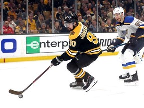 Marcus Johansson of the Boston Bruins is pursued by Colton Parayko of the St. Louis Blues during the third period in Game Five of the 2019 NHL Stanley Cup Final at TD Garden on June 06, 2019 in Boston, Massachusetts.