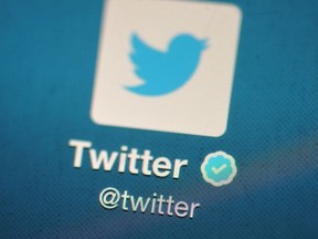 In this photo illustration, The Twitter logo is displayed on a mobile device as the company announced it's initial public offering and debut on the New York Stock Exchange on Nov. 7, 2013 in London, England.
