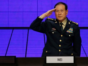 Chinese Defense Minister Wei Fenghe salutes at the IISS Shangri-la Dialogue in Singapore, June 2, 2019. REUTERS/Feline Lim