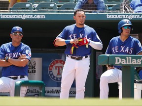 Texas Rangers third baseman Asdrubal Cabrera, centre, stands on the dugout steps after being ejected for arguing balls and strikes during the sixth inning against the Cleveland Indians at Globe Life Park in Arlington. (Ray Carlin-USA TODAY Sports)