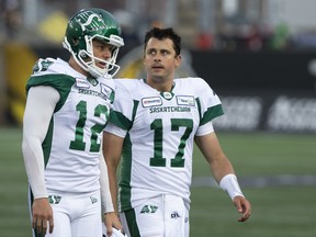 Saskatchewan Roughriders quarterback Zach Collaros looks toward Hamilton Tiger-Cats players as he leaves the field with an injury following a late hit during first half CFL football game action in Hamilton, Ont. on Thursday, June 13, 2019.