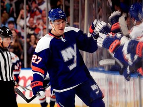 The New York Islanders’ Anders Lee celebrates after a scoring goal against the Tampa Bay Lightning during NHL game on Dec. 20, 2014.