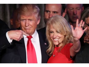 Republican president-elect Donald Trump along with his campaign manager Kellyanne Conway acknowledge the crowd during his election night event at the New York Hilton Midtown in the early morning hours of November 9, 2016 in New York City.