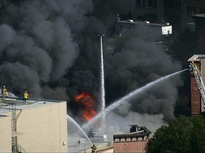 Approximately 300 firefighters battle a huge fire on the backlot of Universal Studios on June 1, 2008 in Universal City, Calif. (Photo by David McNew/Getty Images)