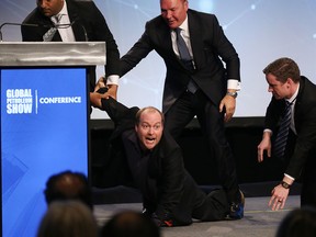 A protester disrupted the opening of the Global Petroleum Show in Calgary ahead of Premier Jason Kenney's speech this morning.