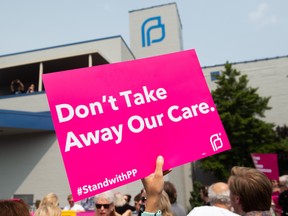 Pro-choice supporters and staff of Planned Parenthood hold a rally outside the Planned Parenthood Reproductive Health Services Center in St. Louis, Missouri, May 31, 2019, the last location in the state performing abortions, after a US Court announced the clinic could continue operating. A US Court on May 31, 2019 blocked Missouri from closing the clinic.