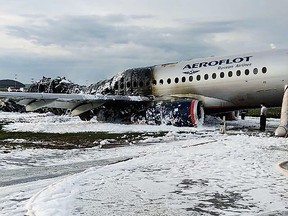 This handout picture taken and released on May 5, 2019 by the City News Agency Moscow shows destroyed fuselage at a site of a fire of a Russian-made Superjet-100 at Sheremetyevo airport outside Moscow following its crash.