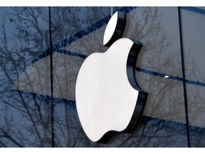This file photo taken on Feb. 8, 2018, shows the Apple logo on the facade of an store in Brussels.