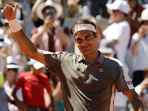 Switzerland's Roger Federer celebrates after winning against Argentina's Leonardo Mayer during their men's singles fourth round match on day eight of The Roland Garros 2019 French Open tennis tournament in Paris on June 2, 2019.
