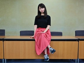 Yumi Ishikawa, leader and founder of the KuToo movement, poses after a press conference in Tokyo on June 3, 2019. - A group of Japanese women on June 3 submitted a petition to the government to protest what they say is a de-facto requirement for female staff to wear high heels at work. The online campaign #KuToo, using a pun from a Japanese word "kutsu" -- that can mean either "shoes" or "pain" --  was launched by actress and freelance writer Yumi Ishikawa and quickly won support from nearly 19,000 people online.