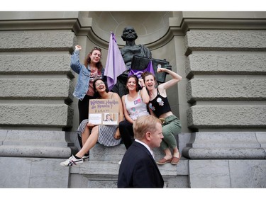 Women take part in a nation-wide women's strike for wage parity outside the federal palace, on June 14, 2019 in Swiss capital Bern.