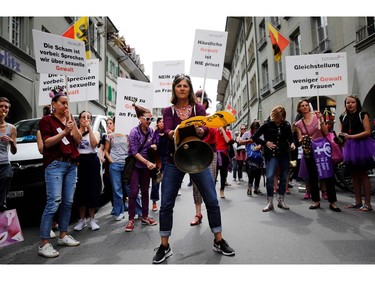 Women take part in a nation-wide women's strike for wage parity, on June 14, 2019 in Swiss capital Bern.