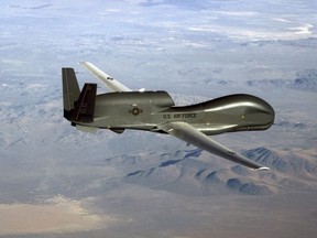 This undated US Air Force file photo released on June 20, 2019 shows a photo of a RQ-4 Global Hawk unmanned surveillance and reconnaissance aircraft. - The United States launched cyber attacks against Iranian missile control systems and a spy network after Tehran downed an American surveillance drone, according to US media reports. US president Donald Trump secretly authorized US Cyber Command to carry out a retaliatory attack on Iran, The Washington Post reported on June 22, 2019, shortly after the US president pledged to hit the Islamic republic with major new sanctions.