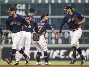 Houston Astros second baseman Jose Altuve (27) and centre fielder Jake Marisnick (6) celebrate with teammates after defeating the Seattle Mariners at Minute Maid Park. (Troy Taormina-USA TODAY Sports)