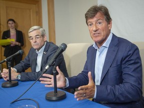 Stephen Bronfman, right, and Pierre Boivin speak to the media on Wednesday about the prospect of Major League Baseball returning to Montreal.