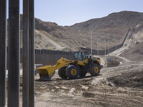 Construction crews work on a border wall being put in place by We Build The Wall Inc. on June 1, 2019 in Sunland Park, New Mexico. (Joe Raedle/Getty Images)