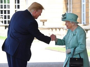 Queen Elizabeth greets U.S. President Donald Trump as he arrives for the Ceremonial Welcome at Buckingham Palace, in London, Britain June 3, 2019. Victoria Jones/Pool via REUTERS
