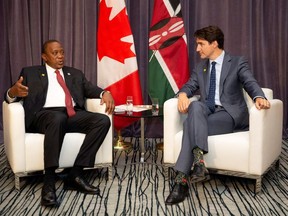 Kenya's President Uhuru Kenyatta and Canadian Prime Minister Justin Trudeau speak during a meeting at the Fairmount Pacific Rim hotel in Vancouver, B.C., Canada June 3, 2019.