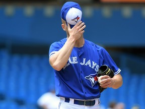 Toronto Blue Jays starting pitcher Clayton Richard reacts as he waits to be relieved by manager Charlie Montoyo (not shown) after giving up eight runs to Arizona Diamondbacks in the third inning at Rogers Centre. (Dan Hamilton-USA TODAY Sports)